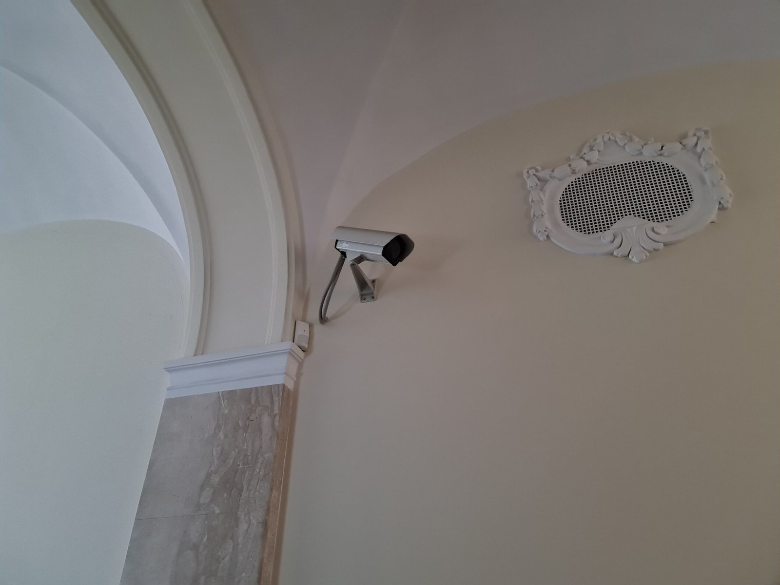 Security camera mounted on a building