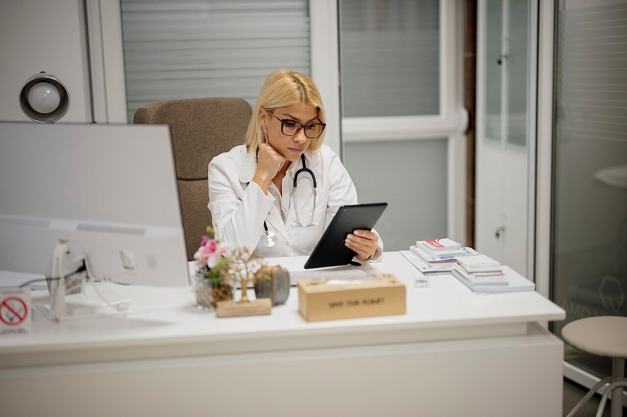A person on a video call using a tablet in landscape orientation