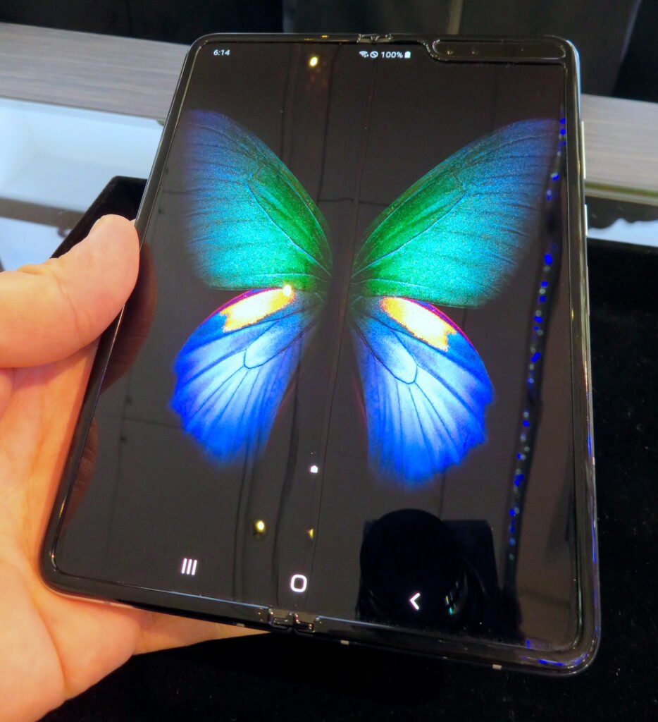 A foldable phone partially opened showing its hinge