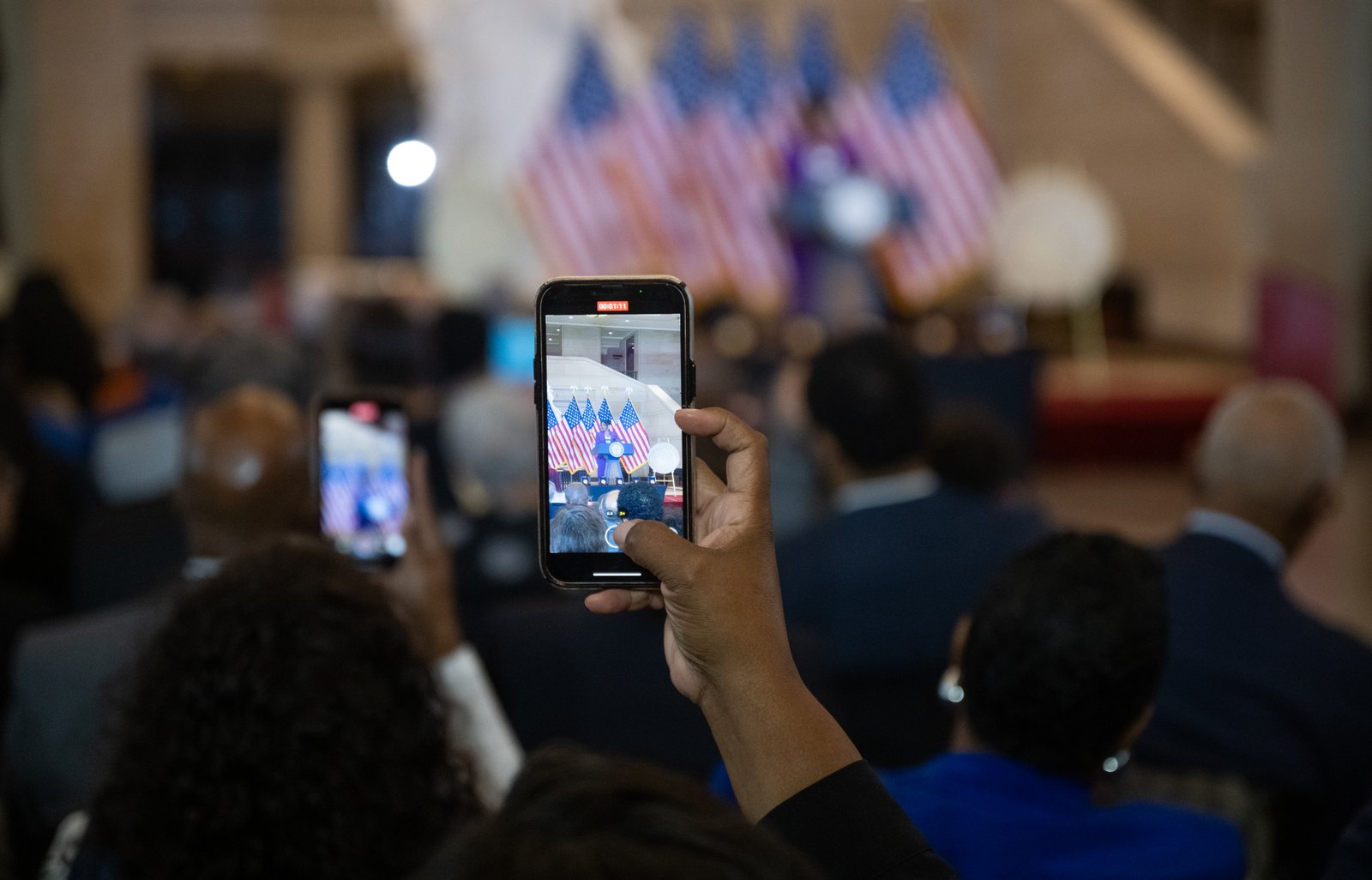 Students listening at a launch ceremony in a large hall