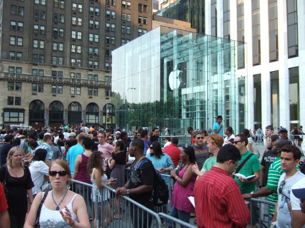 A shopper queuing outside a phone store