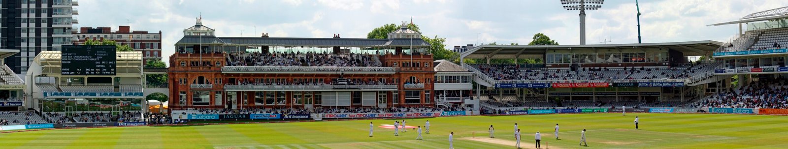 A cricket crowd in a stadium stand