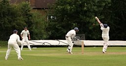 A cricket batsman playing a shot