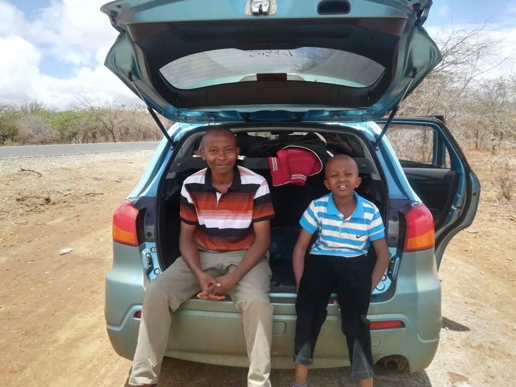 Two people on a road trip in a car