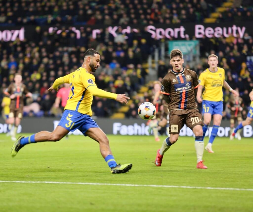 Football striker shooting at goal