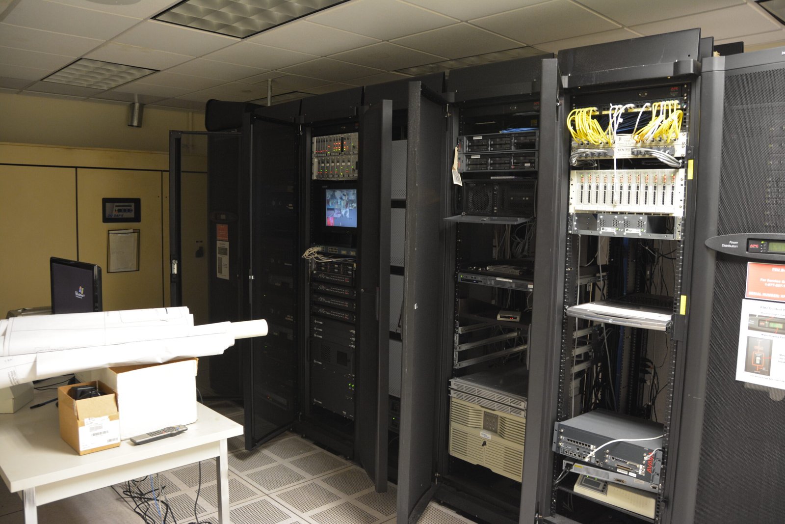 A computer server room with rows of equipment