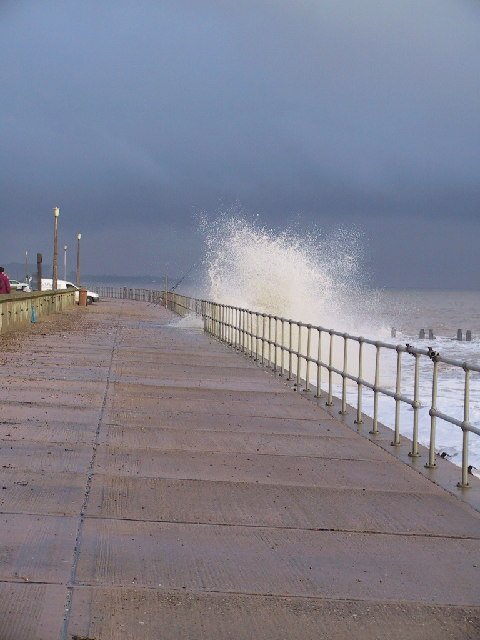 Storm waves crashing against a coastline