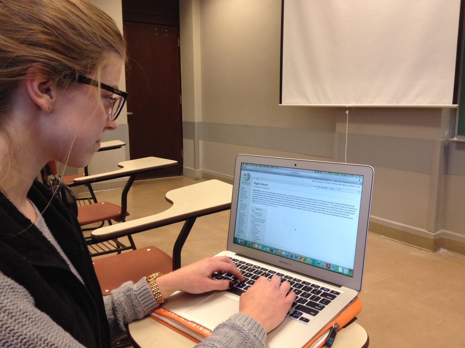 Student using a laptop for online study — protecting students from online threats