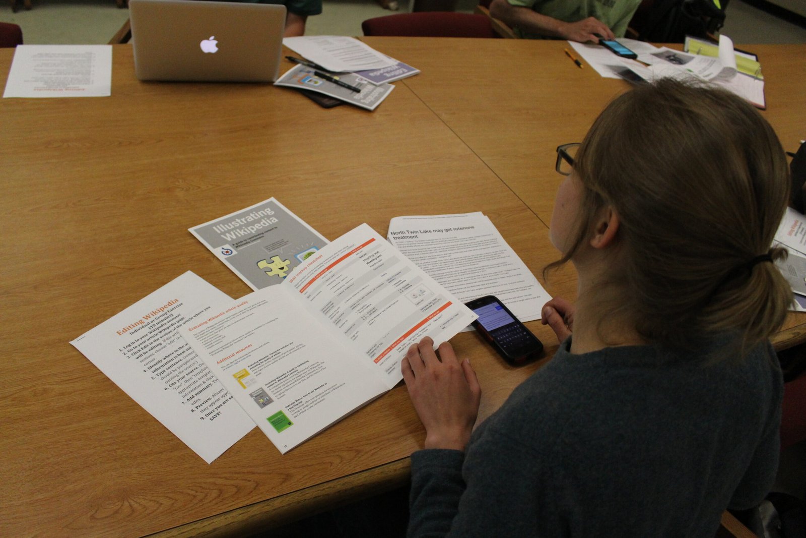 A student using a smartphone to study