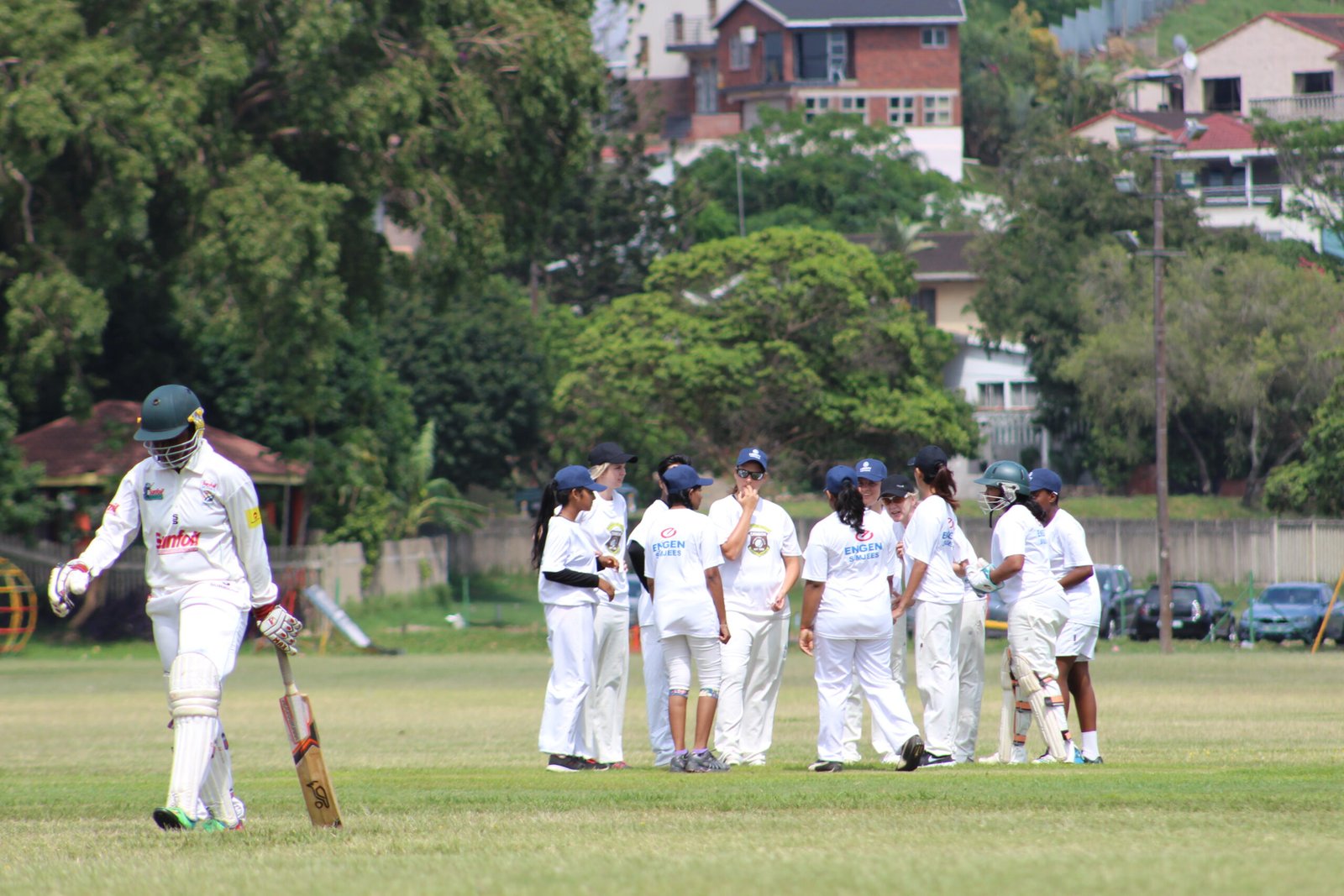 Cricket players celebrating a wicket