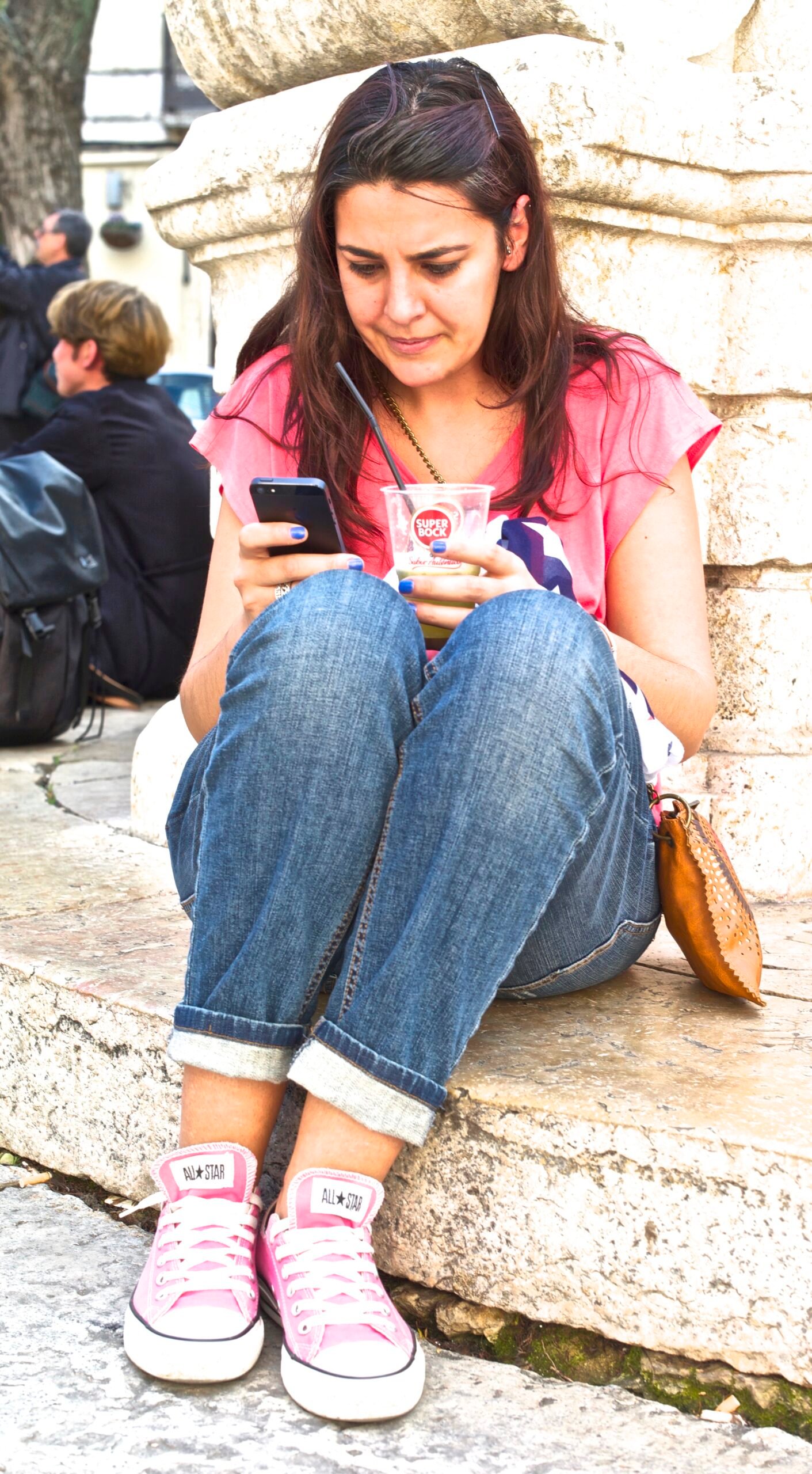 A person reading a smartphone