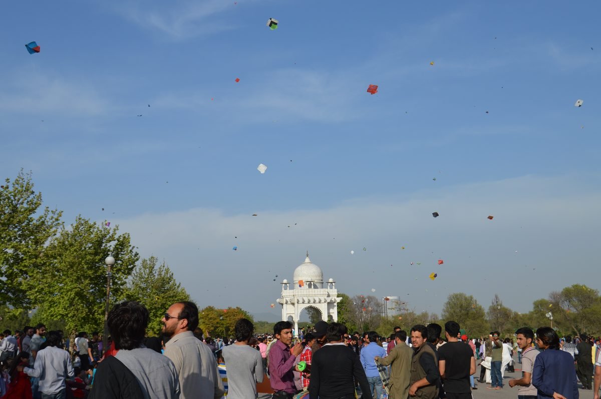 Colourful kites in the sky over a park during the Basant festival in Pakistan