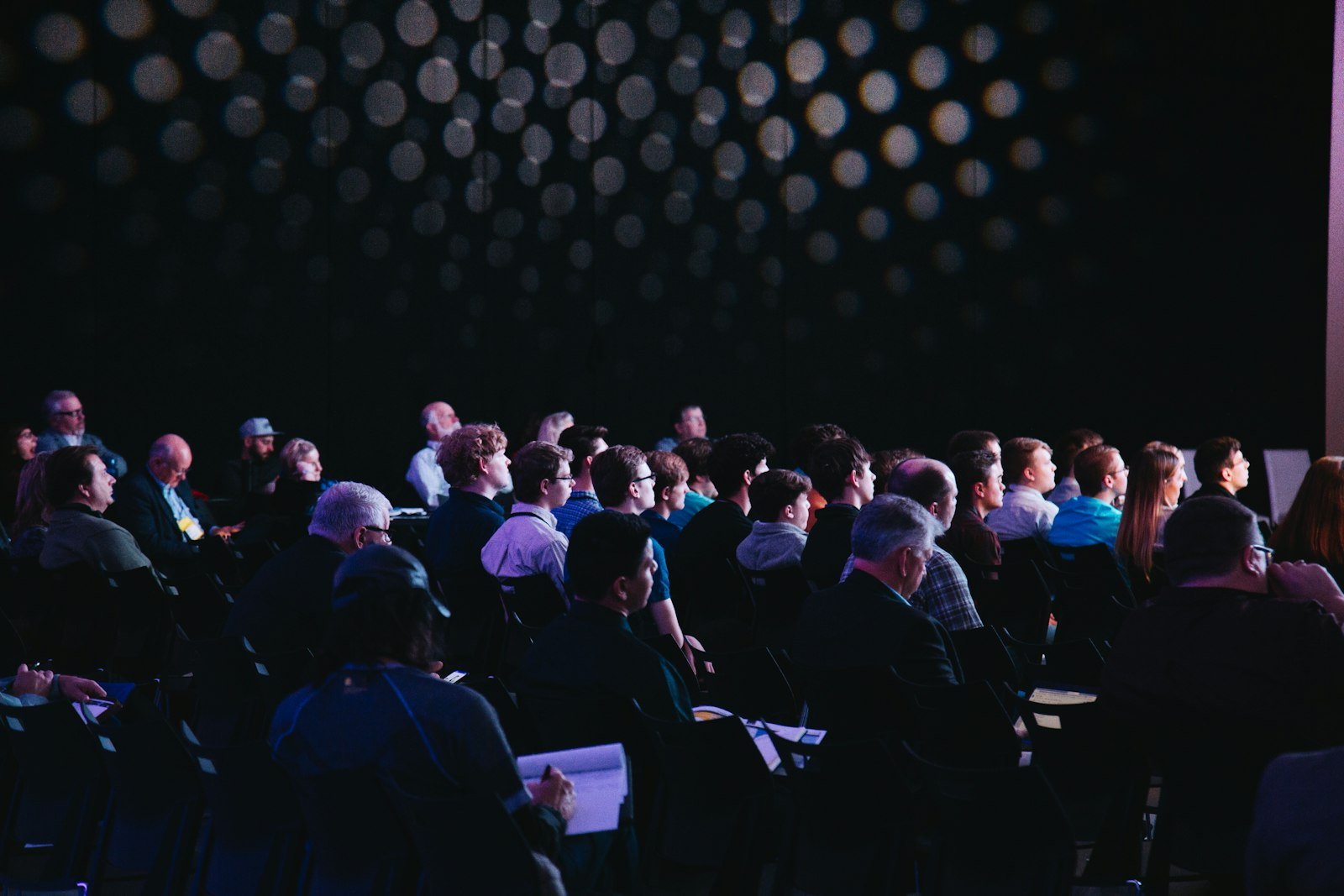An audience watching a technology product launch event