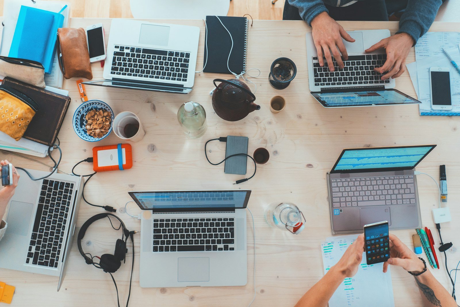 A professional working on a laptop in a bright office