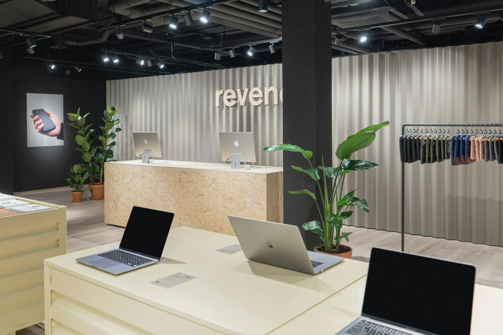 Laptops on display inside an electronics retail store