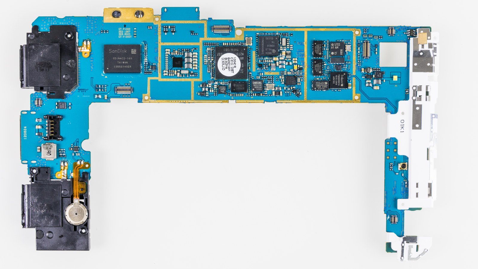 Close-up of a blue printed circuit board with chips, capacitors and connectors — the mainboard of a Samsung Galaxy Tab GT-P1000.