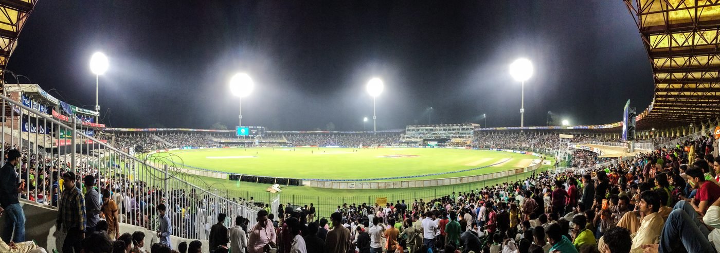 Gaddafi Stadium glowing under floodlights at night, representational image for the HBL PSL Sixes