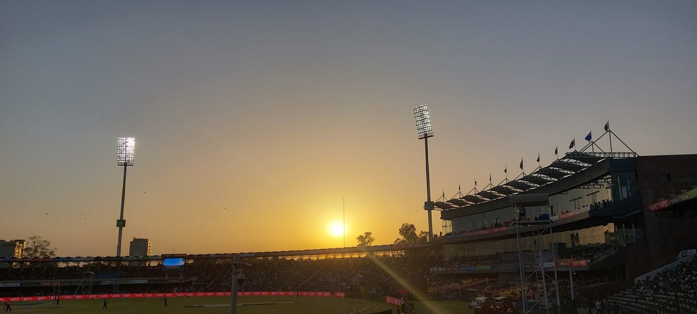 Batsman and fielder in action during a day match, representational image for the HBL PSL Sixes